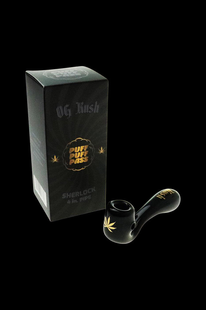 A close-up, angled view of the Puff Puff Pass "OG Kush" Strain Pipe, showing its dark-colored bowl and smooth design.