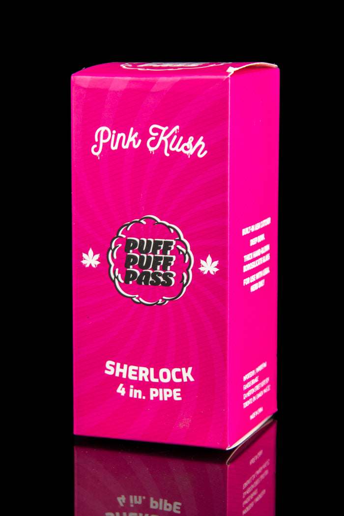 Pink box for “Puff Pass” Sherlock 4-inch pipe, featuring cannabis leaf graphics and text indicating it's for herbal use only.
