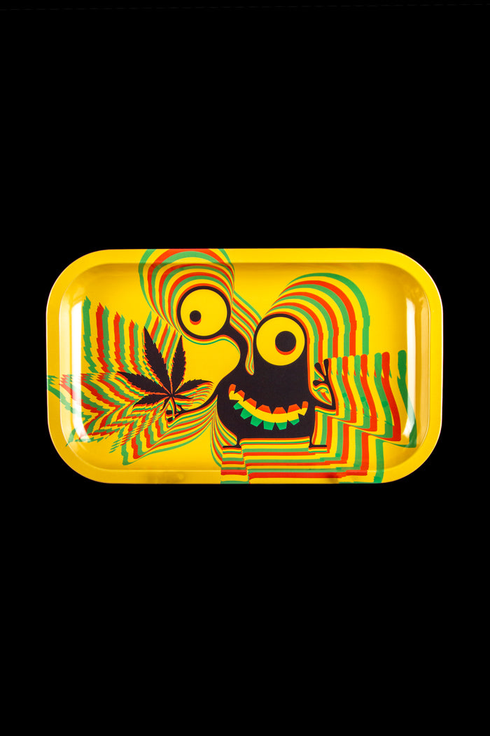 Colorful rolling tray with cannabis leaf and distorted face design on a yellow background.