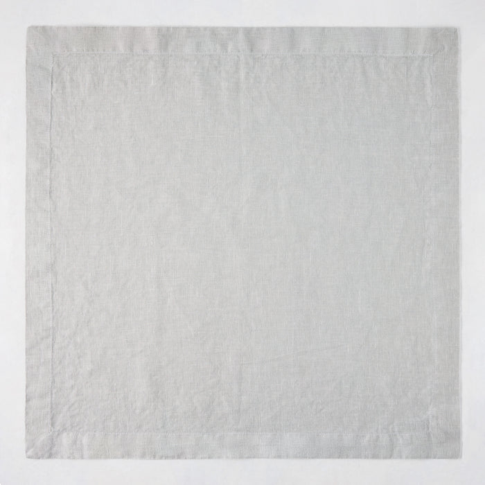 Rain HG Signature hand-dyed light grey linen napkin, 22-inch square with mitered corners.