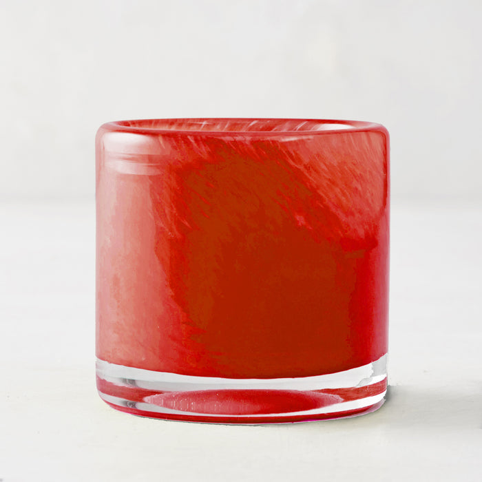 Red glass votive candle holder, mouth-blown with unique swirls, clear base, 2.7" x 2.7".
