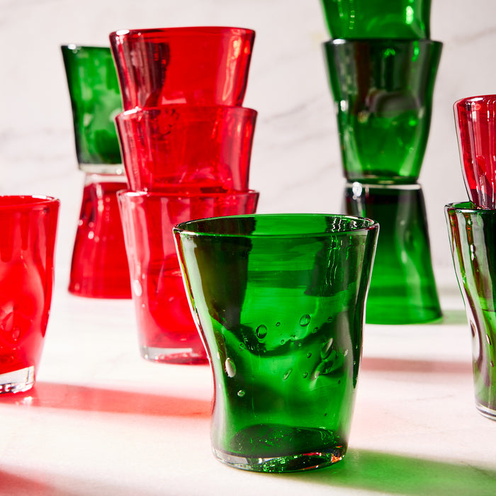 Handmade red and green Henri mouth-blown glass tumblers with unique imperfections and air bubbles.