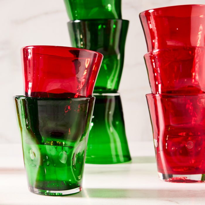 Stacked red and green Henri mouth-blown 8 oz. glasses with unique imperfections.