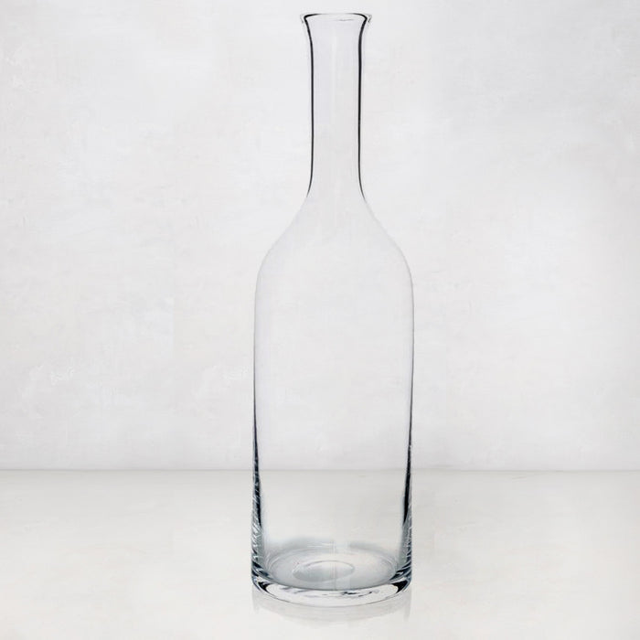 Clear, tall Romeo Scissor-Cut mouth-blown glass wine carafe with a narrow neck and wide base.