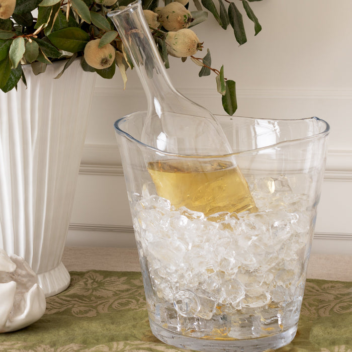 Clear mouth-blown glass Romeo wine carafe with scissor-cut rim, chilling in ice inside a clear Zion bucket.