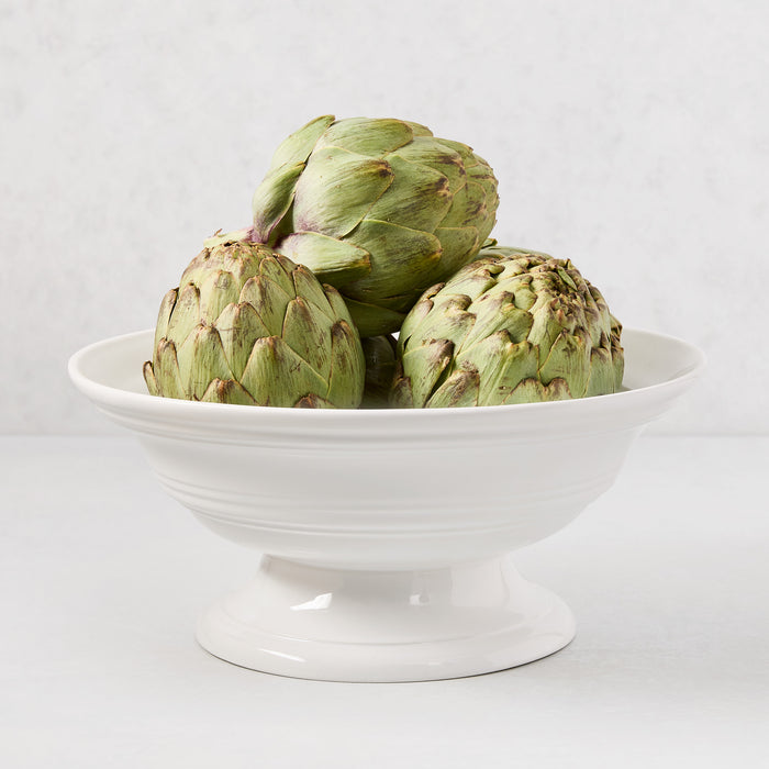 HG Round Ceramic Footed Bowl, 11.5"Dia. x 6"H, white, with three green artichokes.