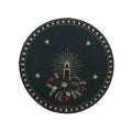 green linen doily with candlelight embroidery candles stars and festive holiday design