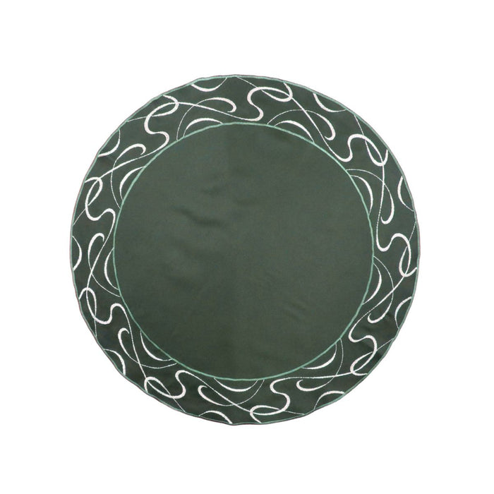Round green table linen with embroidered scroll border and solid center design