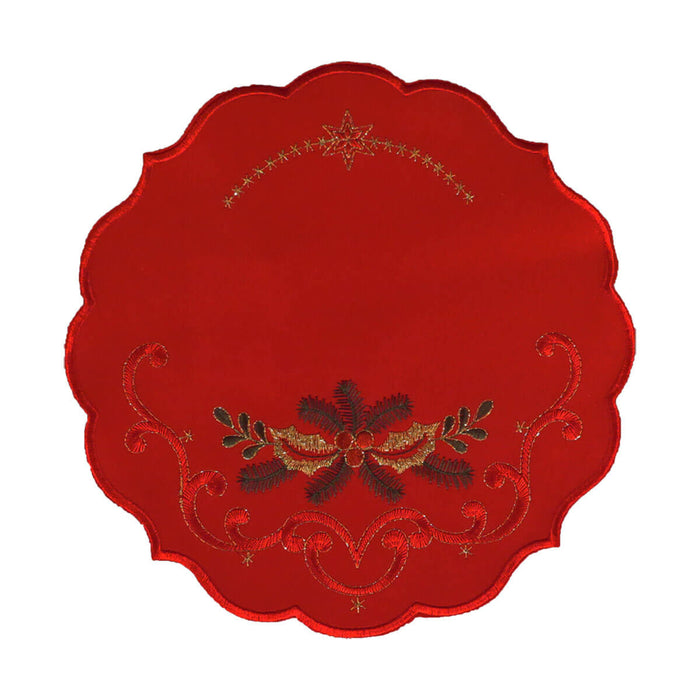 Round red table linen with a design of a bough of holly branches, leaves, and berries, and gold stitching and stars at the top.