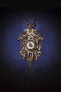 Traditional clock with antique-style clock dial on royal blue background.