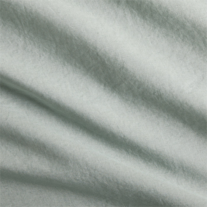 Sage green washed Italian linen pillow sham fabric with subtle wrinkles and texture.