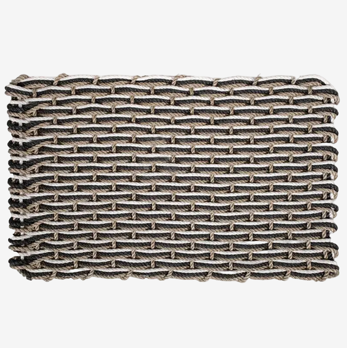 Handwoven Sand, Charcoal, Pearl Rope Doormat with a tight, rectangular weave.