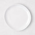 Sandia White 7.75" melamine salad plate with organic, hand-thrown-inspired curves.