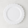 White ceramic scalloped salad plate, 8.75" diameter, on a light background.