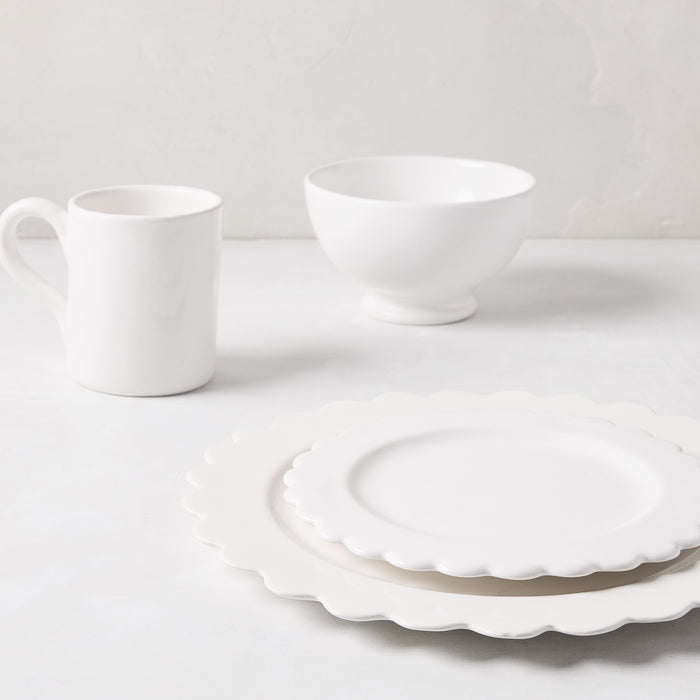 White ceramic scalloped salad plate, 8.75" diameter, stacked on a larger plate with a mug and bowl.
