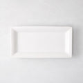 Small Lucca rectangular serving platter, white ceramic, 17"L x 9"W, modern sleek design.