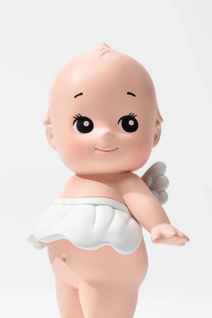 Smoko Kewpie®️ Blind Box Figure featuring a stylized baby-angel figurine with large eyes, tiny wings, and white scalloped cloth, ideal for art toy collectors.