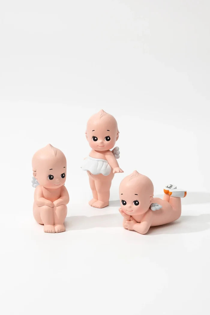 Smoko Kewpie®️ Blind Box Figure features three chubby, angelic baby figurines with wings, each uniquely posed, offering a surprise collectible experience.