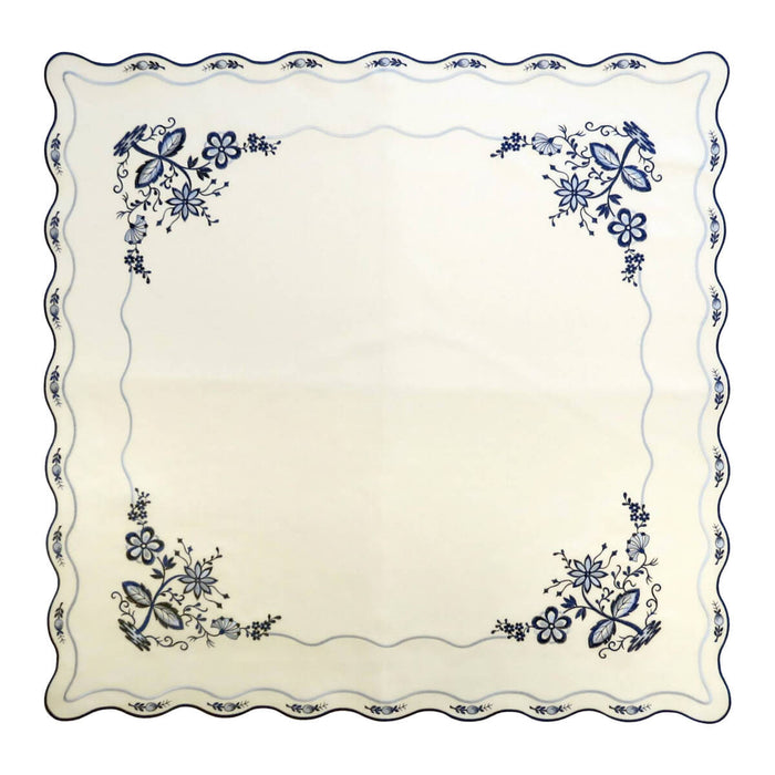 Square white linen tablecloth with Blue Onion embroidery, small blue onions around the rim and blue flowers blooming in the corners.