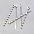 Set of six silver stainless steel cocktail picks, 3.75"L, with a ring top design.