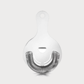 Silver stainless steel Hawthorne cocktail strainer with a tight spring coil and finger rest.