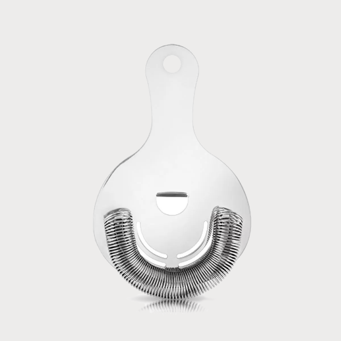 Silver stainless steel Hawthorne cocktail strainer with a tight spring coil and finger rest.