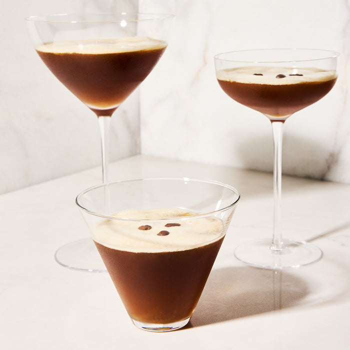 Hudson Grace Stemless Martini Glass with espresso martini, clear glass, wide brim, conical top.
