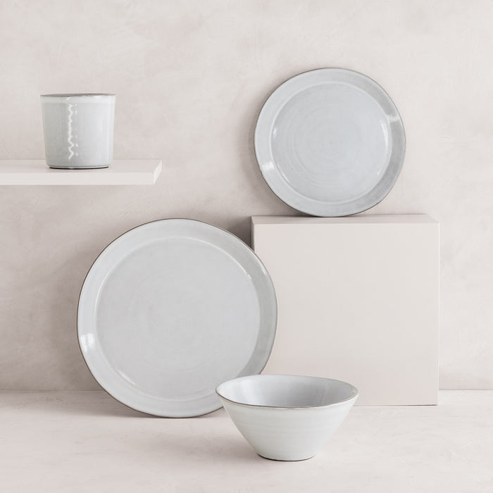 Stone grey hand-glazed terracotta mug, dinner plate, salad plate, and bowl with a subtle rim.