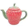 Pink strawberry-shaped teapot with green leaves