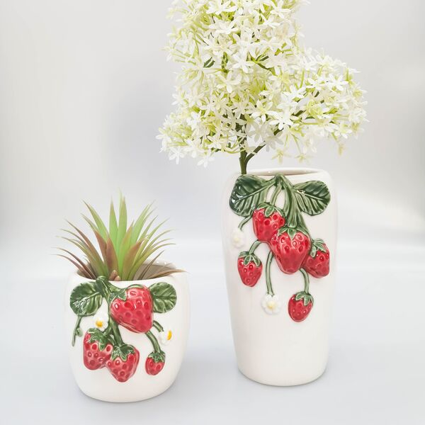 Two ceramic vases with strawberry design