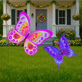 Set of vibrant butterfly yard art decoration signs with stakes. One butterfly is shades of pink and purple primarily while the other is bright shades of blue with some purple. Butterfly lawn decorations are a perfect addition to any yard, garden, walkway or even front porch or walkway. Brighten up your outdoor landscaping today with these colorful butterfly decorations.