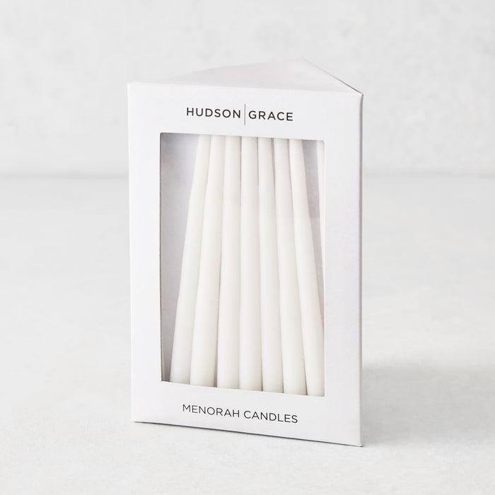 Box of 45 slender, white hand-dipped paraffin taper candles for a Hanukkah Menorah by Hudson Grace.
