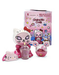 Tokidoki Galactic Cats x Hello Kitty & Friends Blind Box featuring a pink cat figure with accessories: purse, bubble-tea cup, and capsule toy, against themed packaging.