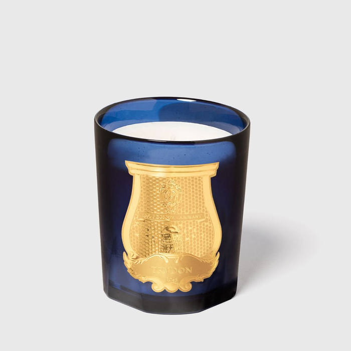 Trudon Salta Classic Scented Candle in a deep blue handmade glass vessel with a gold embossed label.