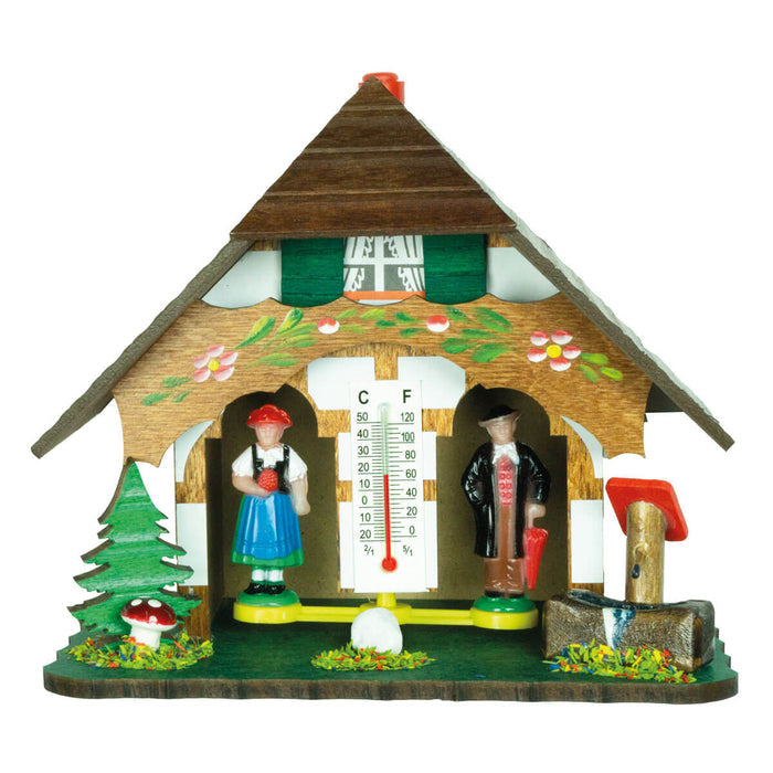 Trenkle Black Forest weather house with deer, pine tree, toadstool, water trough, and traditional chalet design.