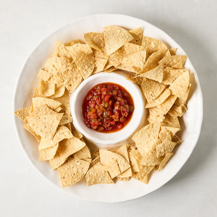 White ceramic 15"Dia chip and dip platter with tortilla chips and salsa.