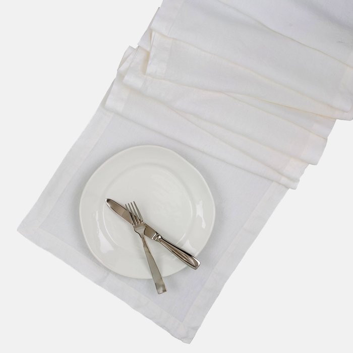 White HG Hand-dyed Linen Table Runner, 18"x108", with mitered corners and a plate setting.