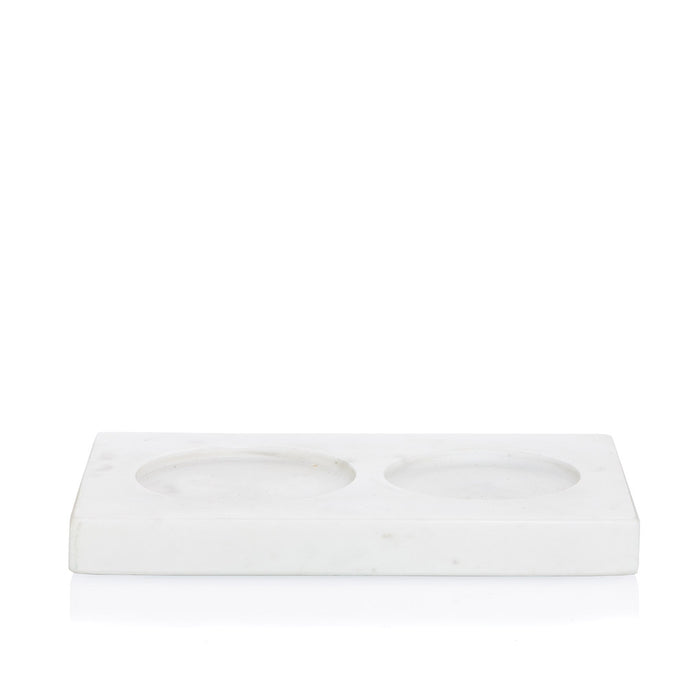 White marble dish soap and lotion tray with two circular indentations.