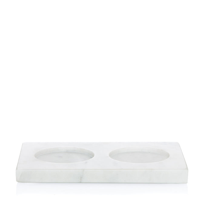 White marble hand soap and lotion tray with two honed circular indentations.