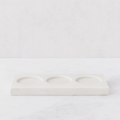 White marble triple soap and lotion tray with three circular indentations.