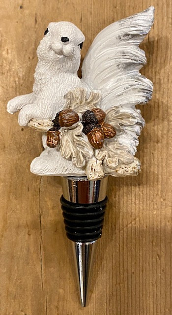 A white squirrel with acorns wine bottle stopper made of resin, hand-painted, atop a stainless steel stopper.