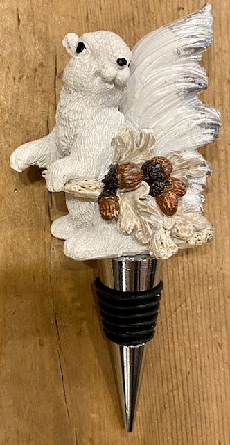 This whimsical resin white squirrel, hand painted, carrying his acorns sits atop a stainless steel wine bottle stopper.