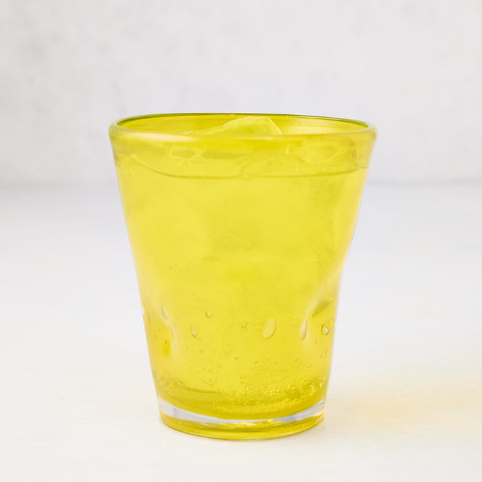 Yellow Henri 8 oz. mouth-blown glass with unique imperfections and small air bubbles.